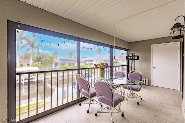 sunroom with a water view