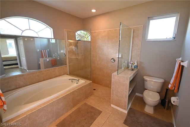 bathroom with tile patterned flooring, shower with separate bathtub, and toilet