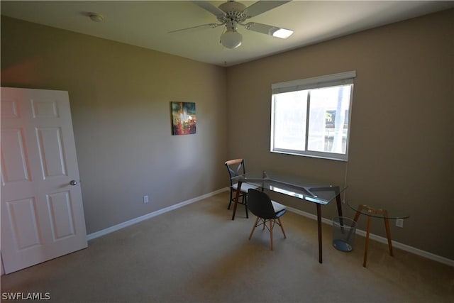 home office with light carpet and ceiling fan