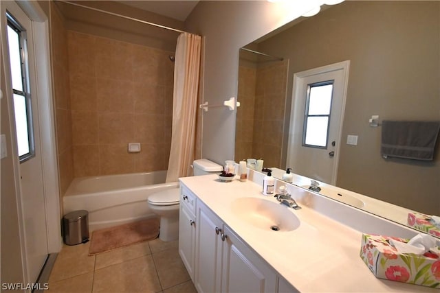 full bathroom with tile patterned flooring, toilet, vanity, and shower / bath combo with shower curtain