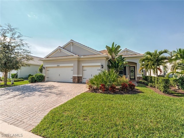 view of front facade with a front yard and a garage