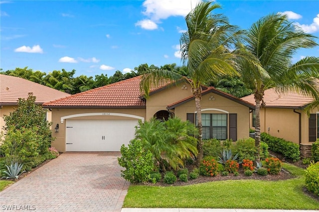 mediterranean / spanish-style home featuring a garage