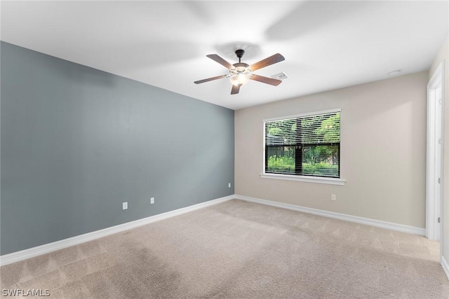 carpeted empty room with ceiling fan