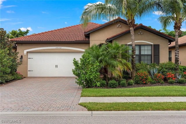 mediterranean / spanish-style house featuring a garage