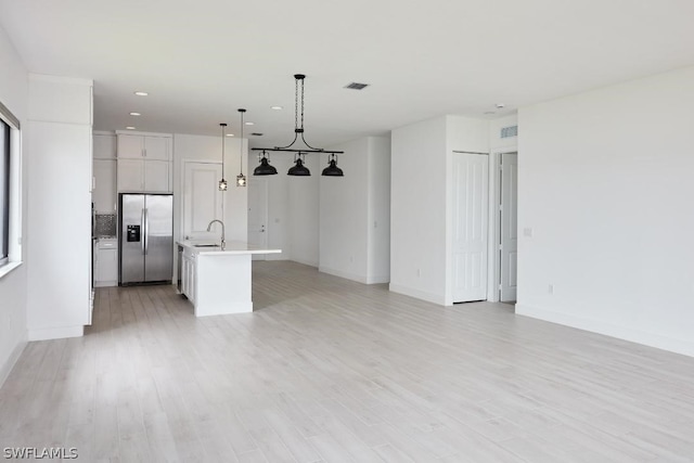 interior space featuring light hardwood / wood-style floors and sink