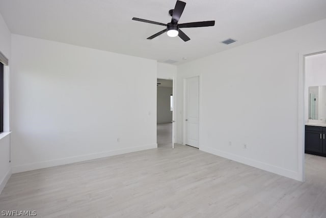 spare room with ceiling fan and light hardwood / wood-style flooring