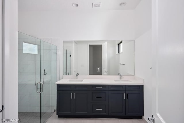 bathroom with vanity, tile patterned floors, and an enclosed shower