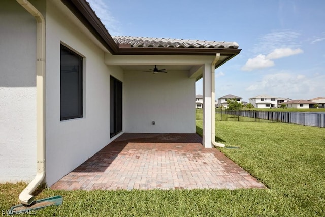 view of patio / terrace featuring ceiling fan