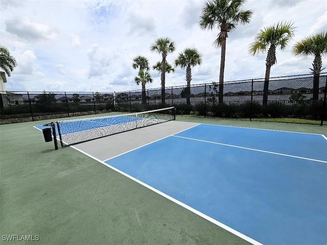 view of tennis court featuring basketball court