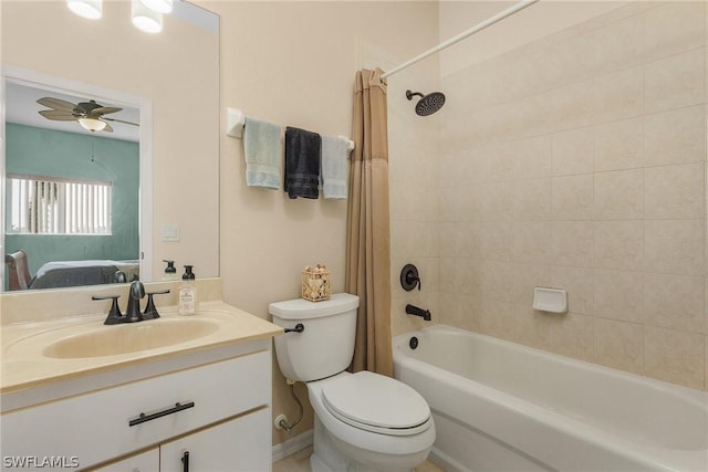 full bathroom featuring shower / bath combo, ceiling fan, toilet, and vanity