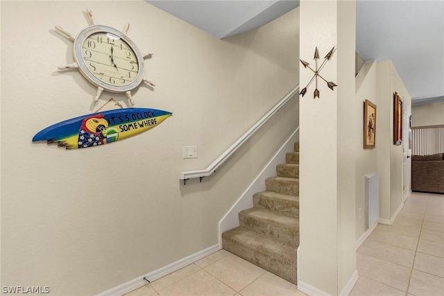 stairs featuring tile patterned flooring