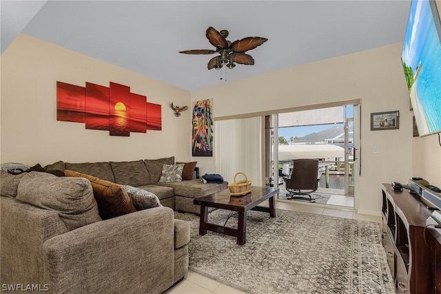 living room featuring ceiling fan and light tile patterned flooring