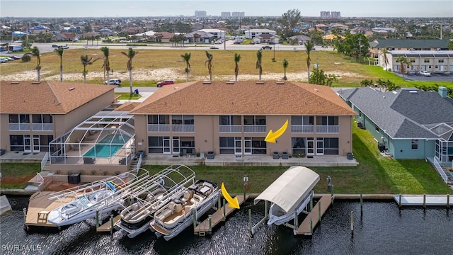 birds eye view of property with a water view