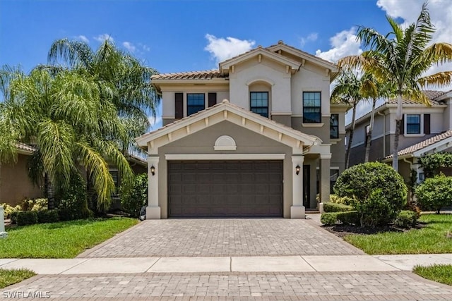 mediterranean / spanish-style home featuring a garage