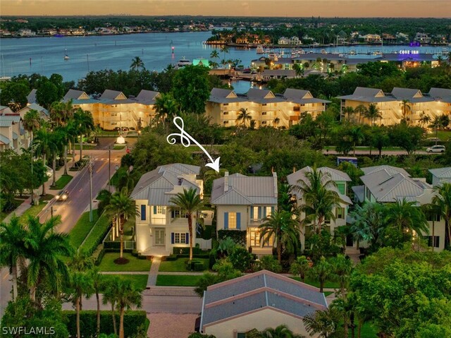 aerial view at dusk with a water view