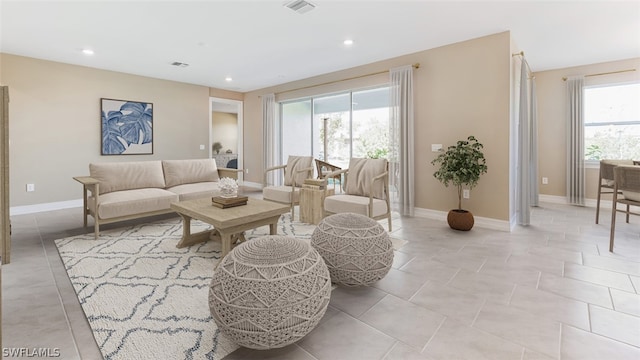 living room with light tile patterned floors