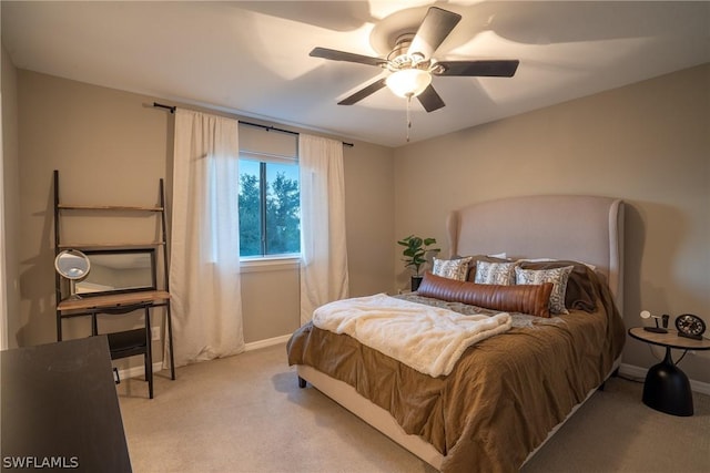 bedroom featuring ceiling fan and light colored carpet