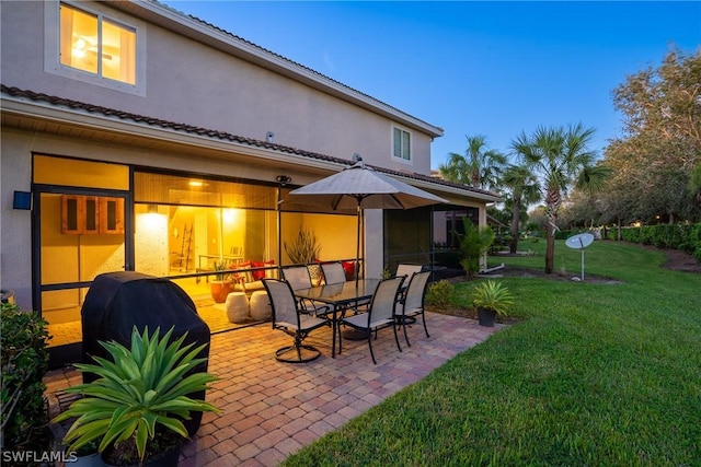 patio terrace at dusk with a lawn