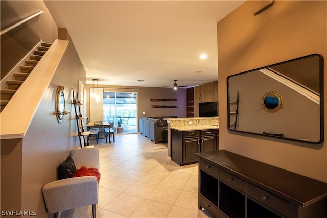 interior space with ceiling fan