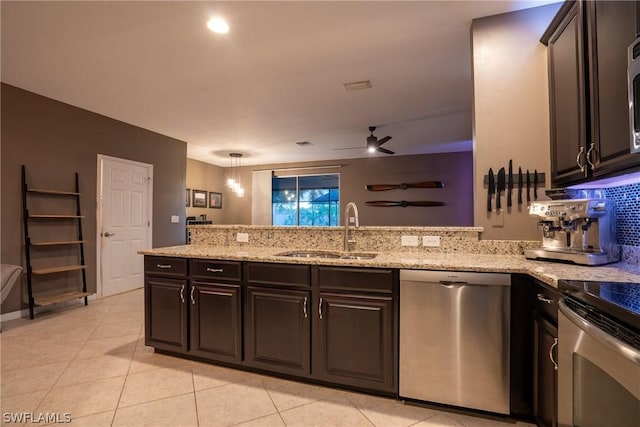 kitchen with dark brown cabinetry, ceiling fan, sink, hanging light fixtures, and stainless steel appliances