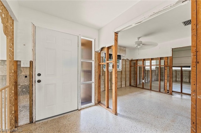 foyer entrance with ceiling fan