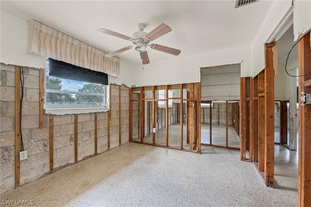 interior space featuring ceiling fan