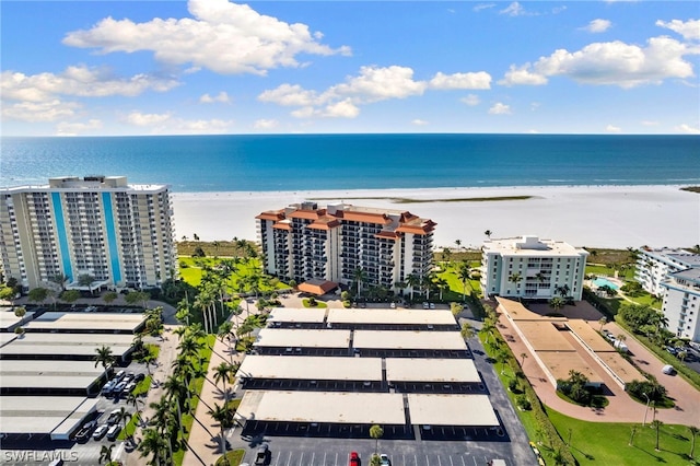 birds eye view of property featuring a water view and a view of the beach