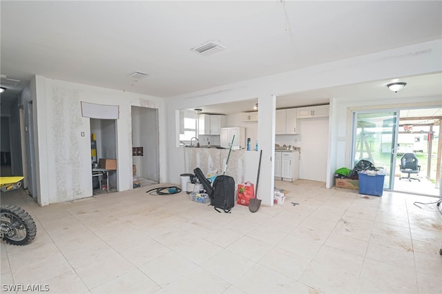 misc room with light tile patterned floors