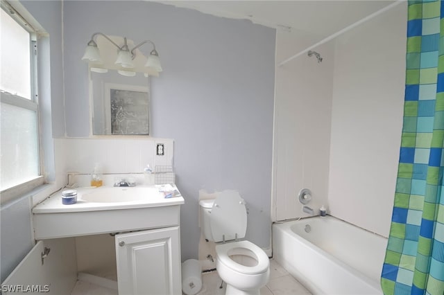 full bathroom featuring shower / tub combo with curtain, vanity, tile patterned floors, tasteful backsplash, and toilet