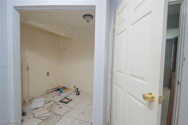 laundry area featuring light tile patterned floors