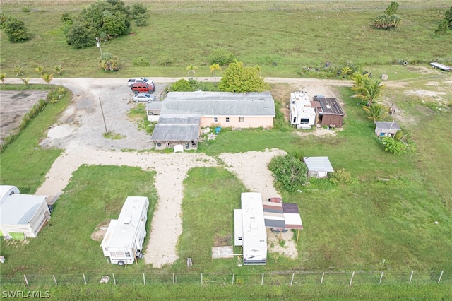 birds eye view of property with a rural view