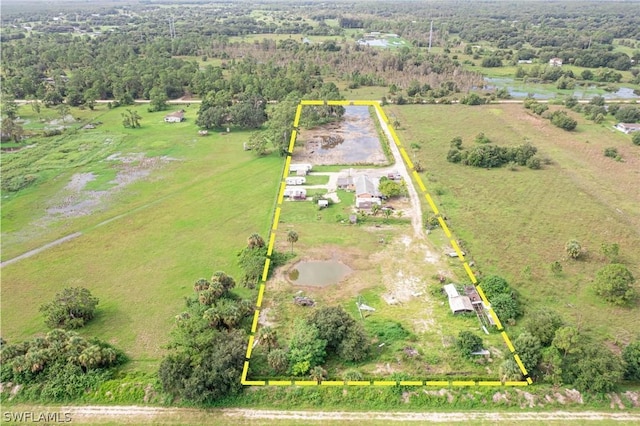 birds eye view of property featuring a rural view