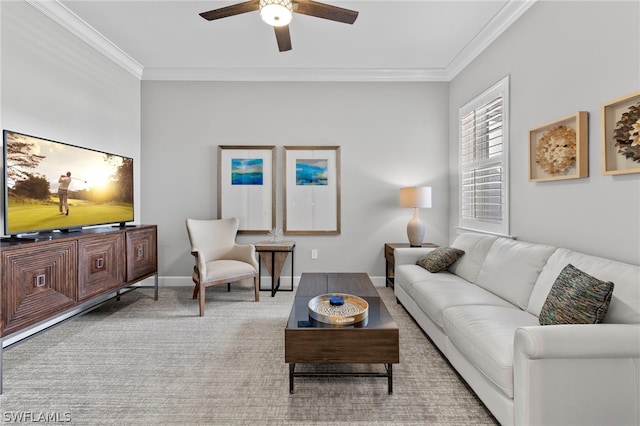 carpeted living room with ceiling fan and ornamental molding