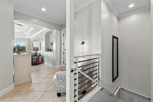 stairs featuring tile patterned flooring and crown molding