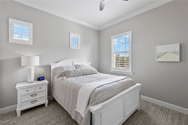 carpeted bedroom featuring ceiling fan and ornamental molding