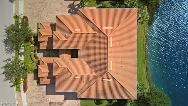 birds eye view of property featuring a water view