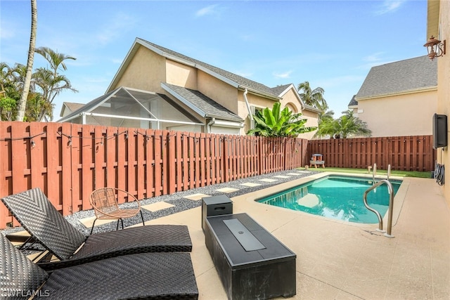 view of pool with a patio area, a fenced in pool, and a fenced backyard