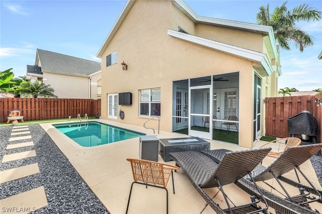 view of swimming pool featuring a patio area, french doors, a fenced in pool, and a fenced backyard