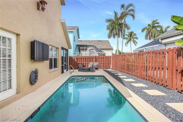 view of pool featuring a patio area