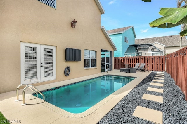 view of pool featuring a fenced in pool, a patio, and a fenced backyard