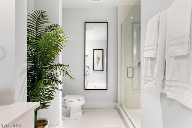 bathroom featuring toilet, an enclosed shower, vanity, and tile patterned flooring