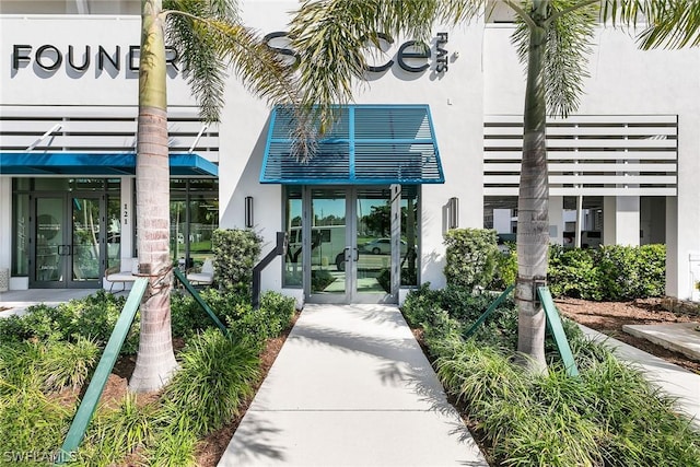 view of exterior entry featuring french doors