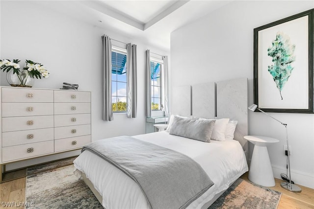 bedroom with hardwood / wood-style flooring