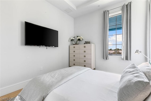 bedroom with hardwood / wood-style floors