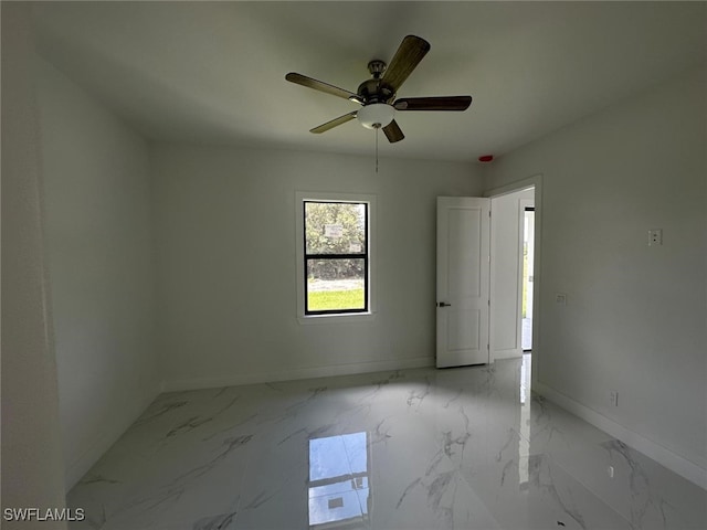 unfurnished room featuring ceiling fan