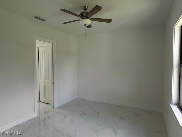 empty room featuring ceiling fan