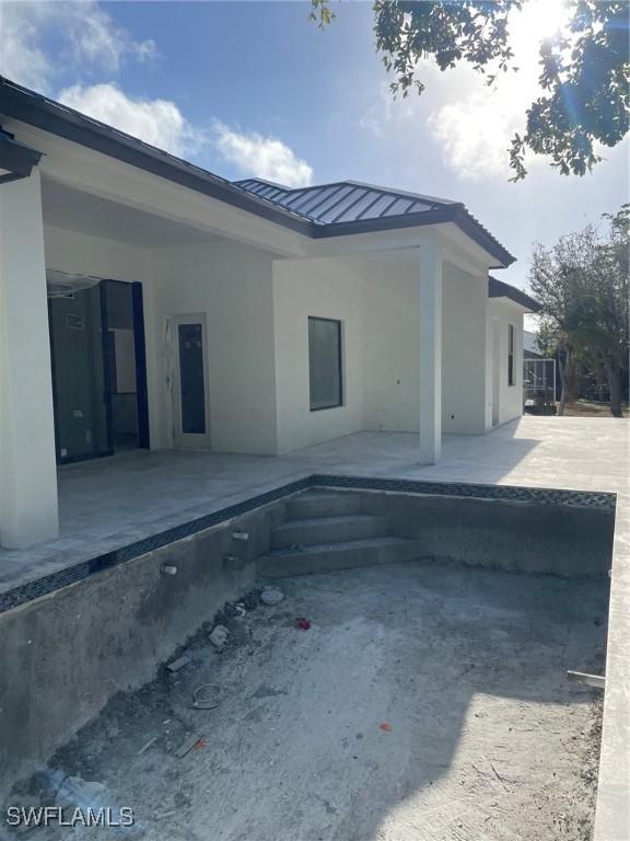 rear view of house with a patio area