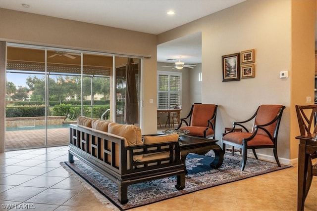 living room with light tile patterned floors and ceiling fan