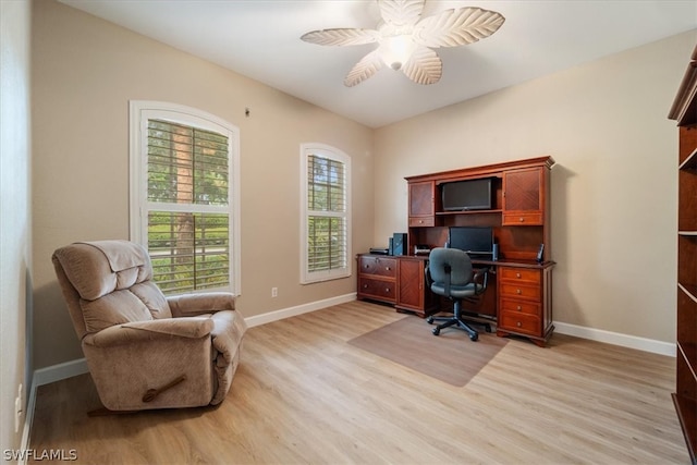 office space with light wood-type flooring and ceiling fan