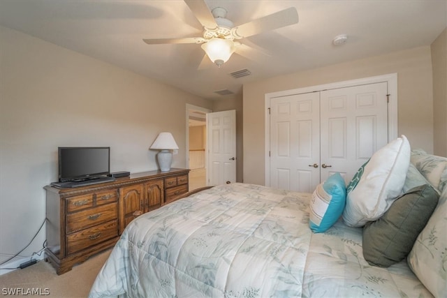 bedroom with light colored carpet, a closet, and ceiling fan